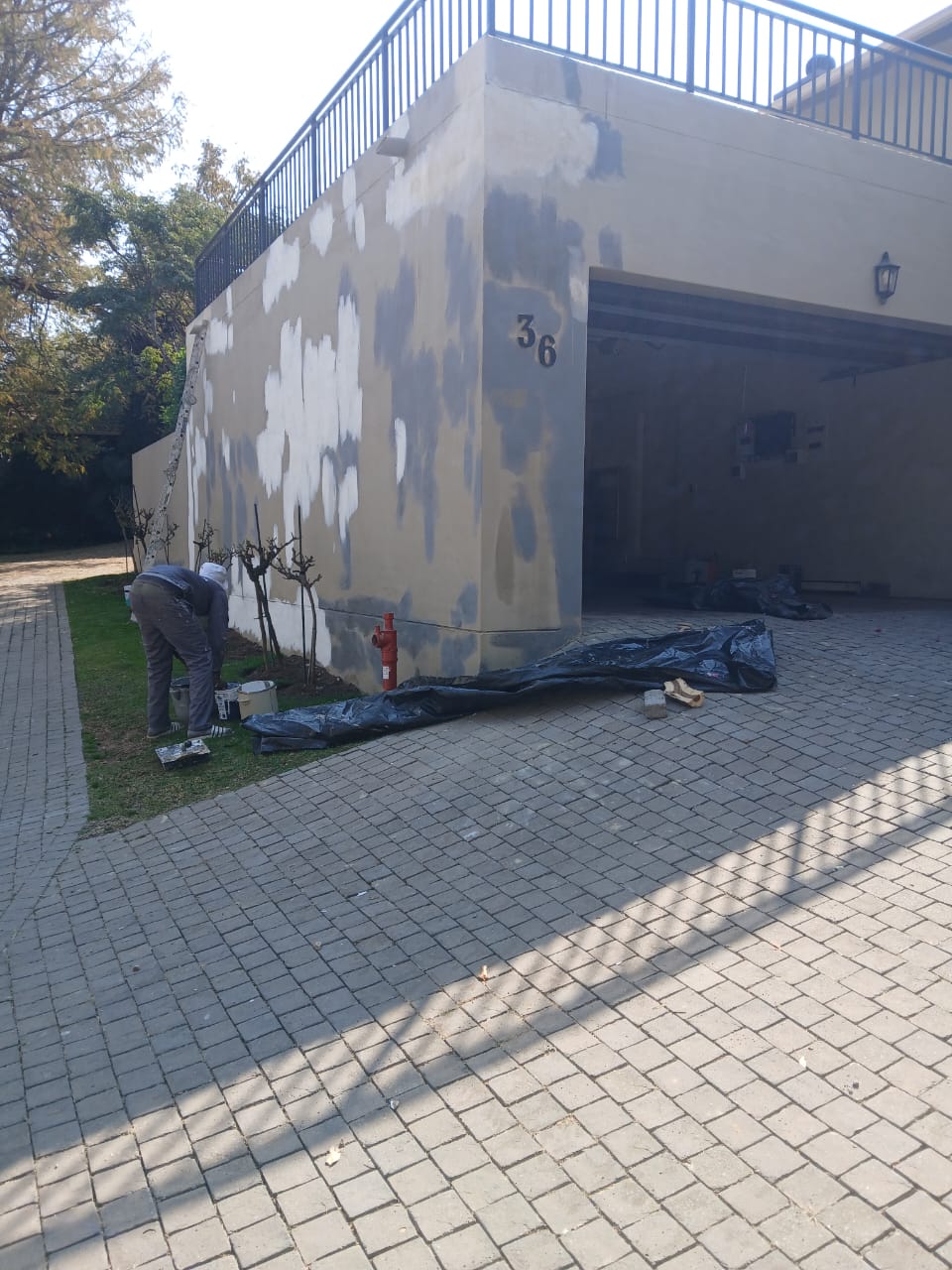 JMProjects Maintenance painter preparing a wall in Cosmo City, Gauteng